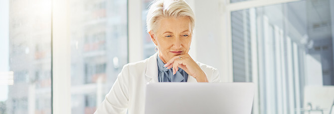 Entrepreneur listening to a virtual conference via webcam